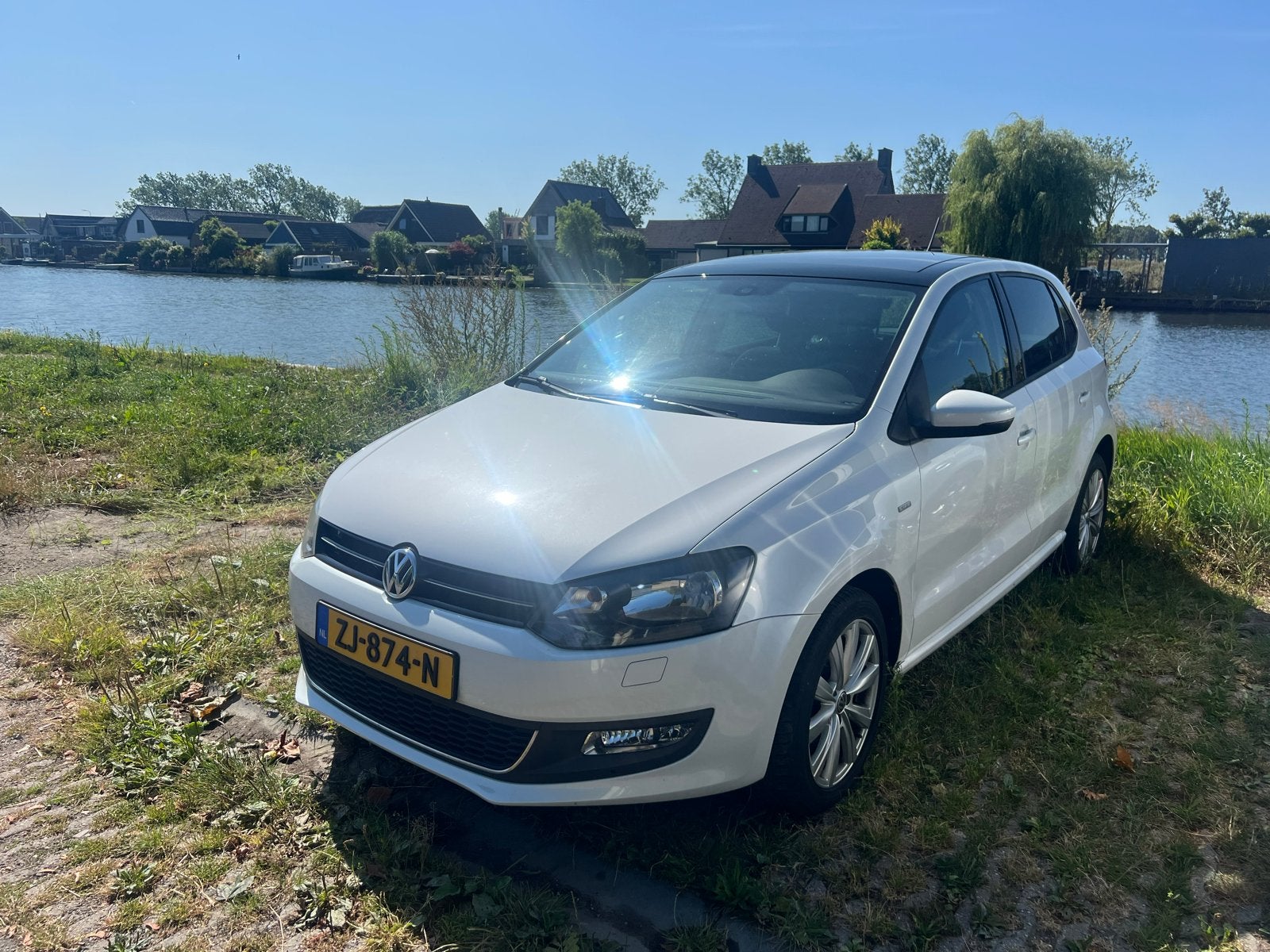Volkswagen Polo 1.2 TSI 66KW 2014 Parelmoerwit ~180.500 km, Voorwielaandrijving, 40 €/maand, 4 cilinders, Wit