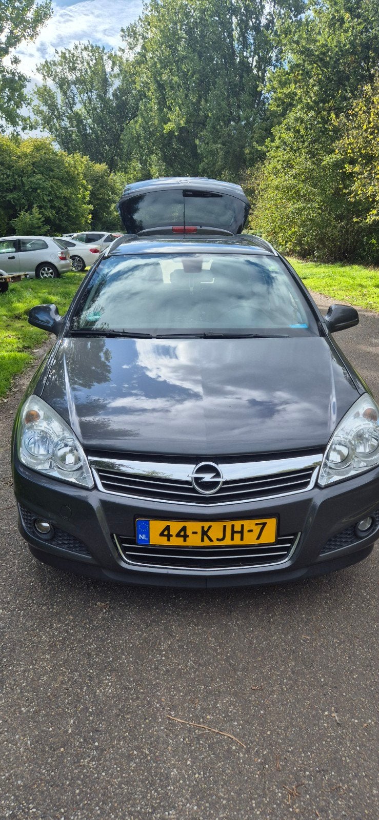 Opel Astra 1.6 16V 85KW St.wgn. 2009 Grijs Stoel verwarming, Auto's, Voorwielaandrijving, 15 km/l, Origineel Nederlands, Stationwagon
