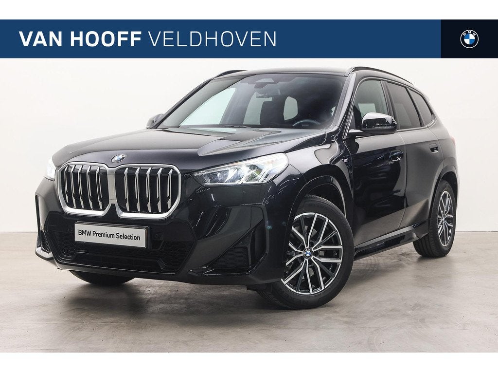BMW X1 sDrive20i M Sport Automaat / Trekhaak / Achteruitrijc, 1525 kg, 156 pk, Met garantie (alle), Zwart