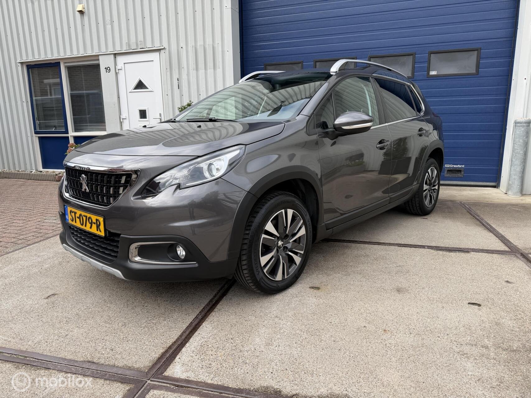 Peugeot 2008 1.2 PureTech Allure, Auto's, Voorwielaandrijving, Leder en Stof, Origineel Nederlands, Bedrijf