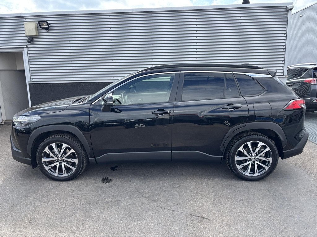 Toyota Corolla Cross 2.0 High Power Hybrid First Edition Nie, Auto's, Toyota, Gebruikt, 4 cilinders, Leder en Stof, Zwart