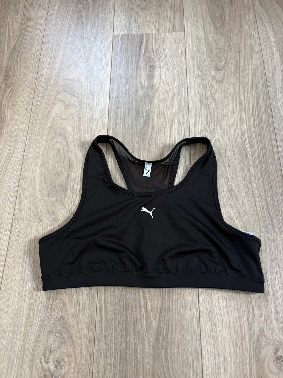 Zwarte korte sporttop - PUMA - maat XL - looks new!, Kleding | Dames, Ophalen of Verzenden, Zo goed als nieuw, Maat 42/44 (L)