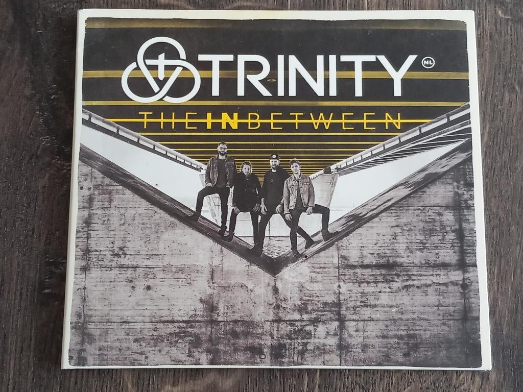 CD  Trinity - The in between (2018)  **VERZ/OPH**, Ophalen, Zo goed als nieuw, Poprock