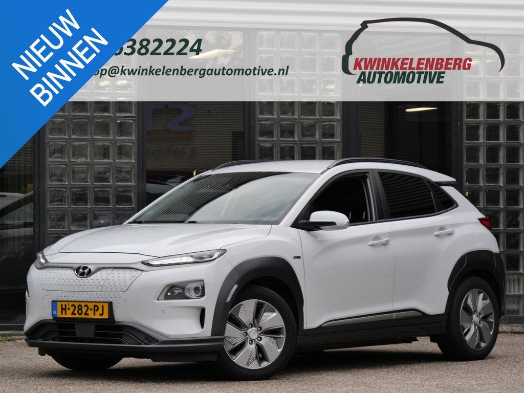 Hyundai Kona EV 64kWh PREMIUM/ LEER/ TREKHAAK/ SOH 100%, Auto's, Hyundai, Gebruikt, Zwart, 64 kWh, 575 min
