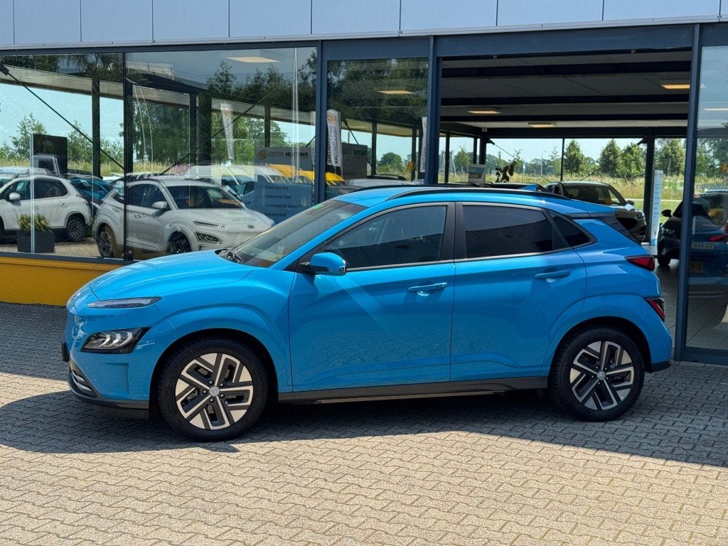 Hyundai Kona EV 64kWh Premium - Navi - camera - stoel/stuur, 12 maanden, 14 kWh, Gebruikt, Blauw