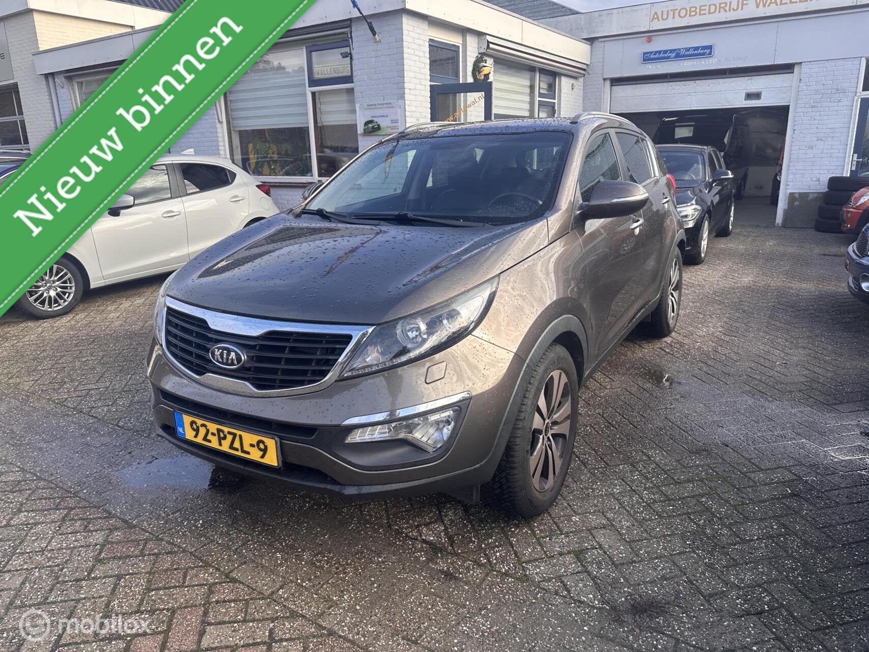 Kia Sportage 2.0 X-clusive, Auto's, Gebruikt, 4 cilinders, Bruin, 163 pk