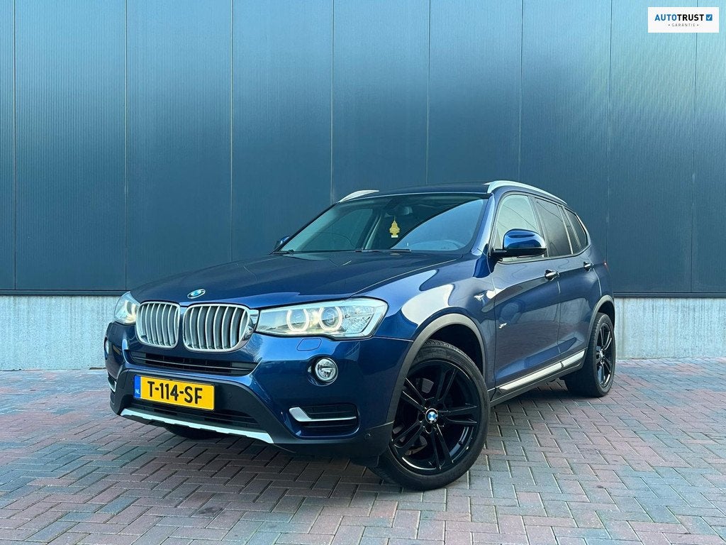 BMW X3 XDrive20d High executive X-Line * Aut * Navi * Cruise, Automaat, Zwart, Blauw, Leder en Stof