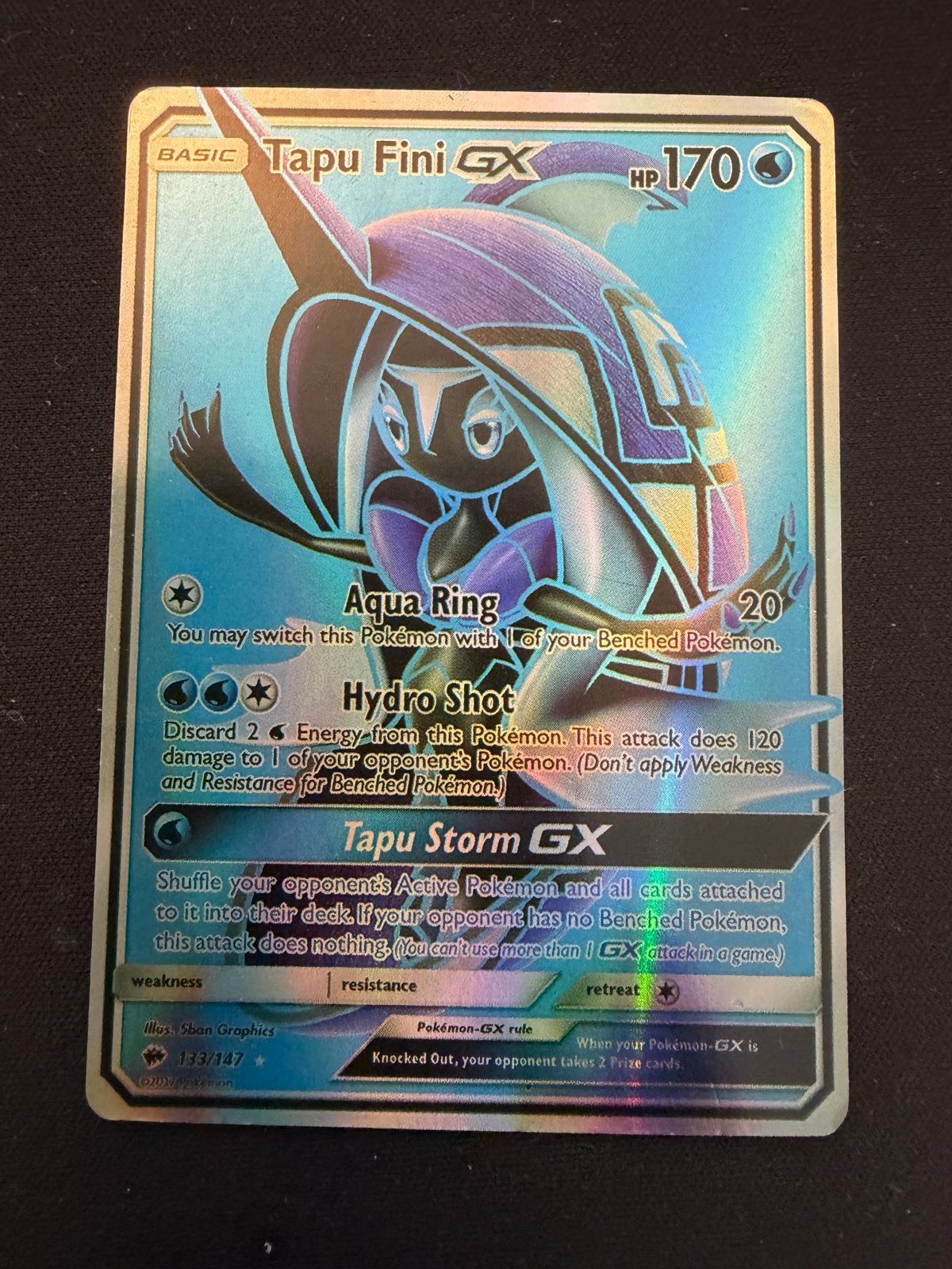 Tapu Fini GX 133/147 Pokémon kaart in sleeve en toploader, Ophalen of Verzenden, Zo goed als nieuw, Losse kaart, Foil