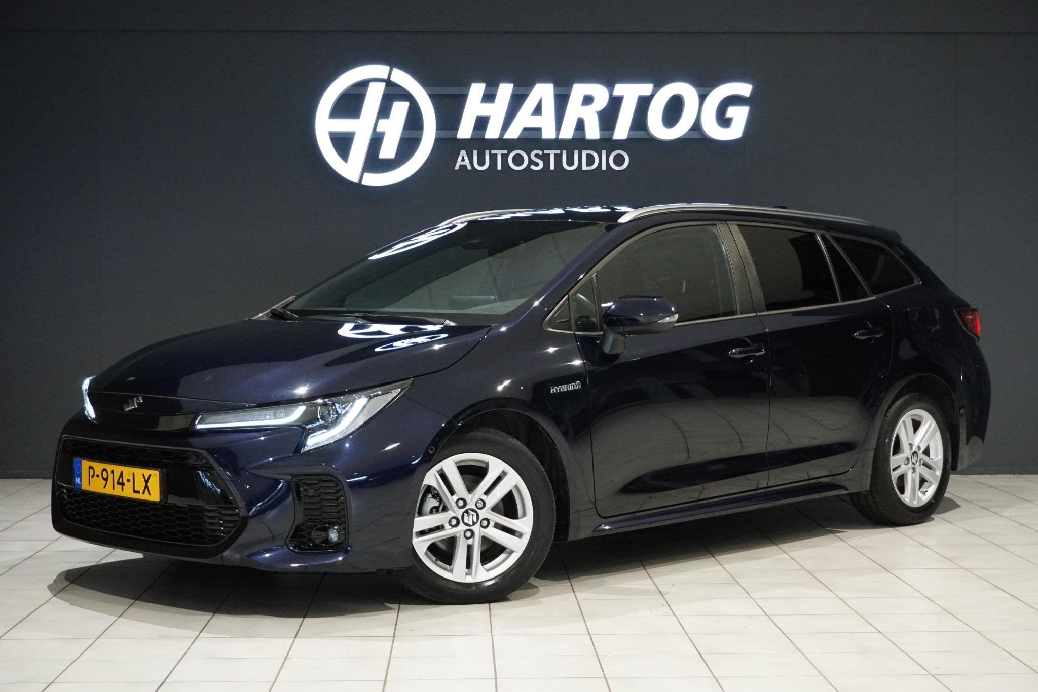 Toyota Corolla 1.8 Hybrid Style + DODEHOEK / STUURVERWARMING, Auto's, Gebruikt, 4 cilinders, Blauw, Corolla