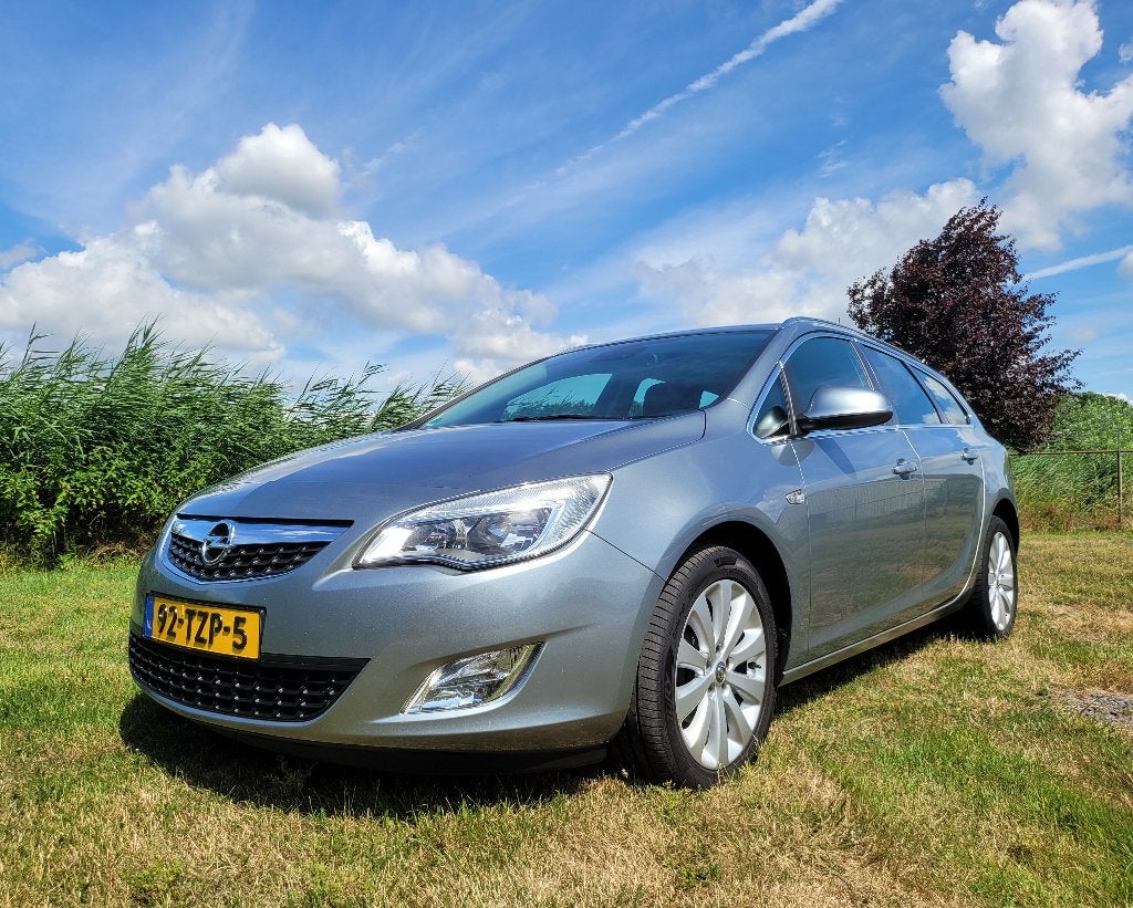 Opel Astra J 1.4 Turbo 103KW Sports Tourer 2012 Airco, NAP, Voorwielaandrijving, Euro 5, Zwart, 4 cilinders
