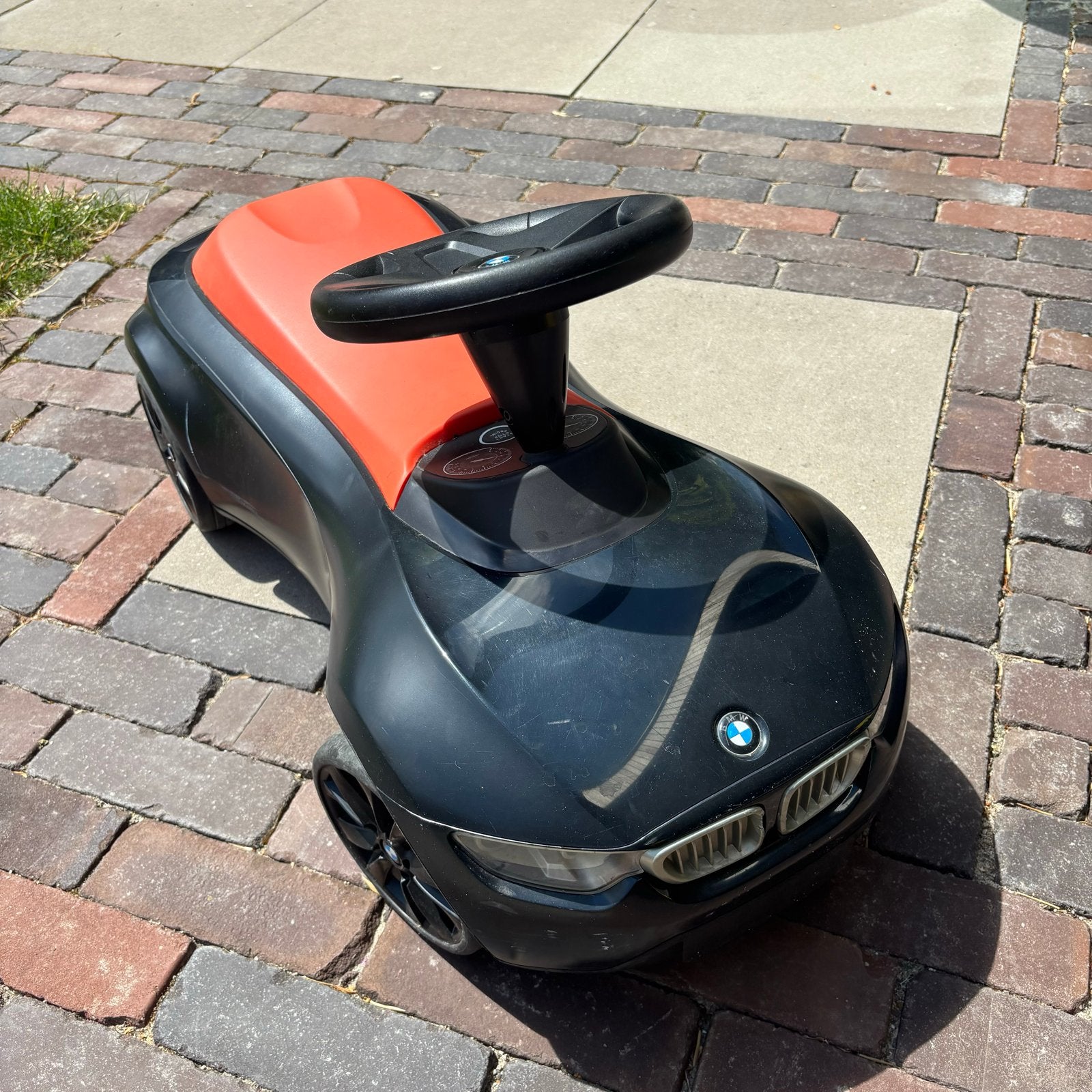 BMW Loopauto Zwart/Oranje baby racer, Ophalen, Zo goed als nieuw, Loopvoertuig