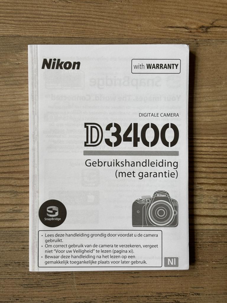 Nikon D3400 Gebruikershandleiding nederlandstalig, Ophalen of Verzenden, Zo goed als nieuw