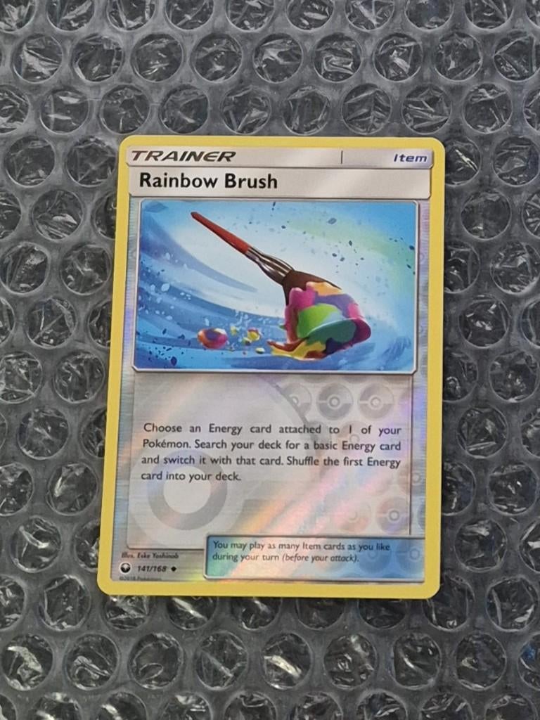 Reverse Rainbow Brush 141/168 Sun & Moon Celestial Storm, Ophalen of Verzenden, Zo goed als nieuw, Losse kaart, Foil