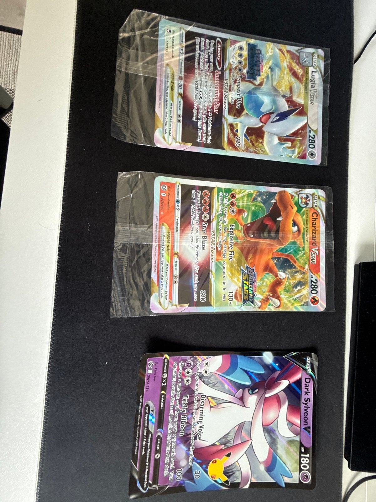 Pokémon Kaarten: Lugia VSTAR, Charizard VSTAR, Dark Sylveon, Ophalen of Verzenden, Zo goed als nieuw, Meerdere kaarten