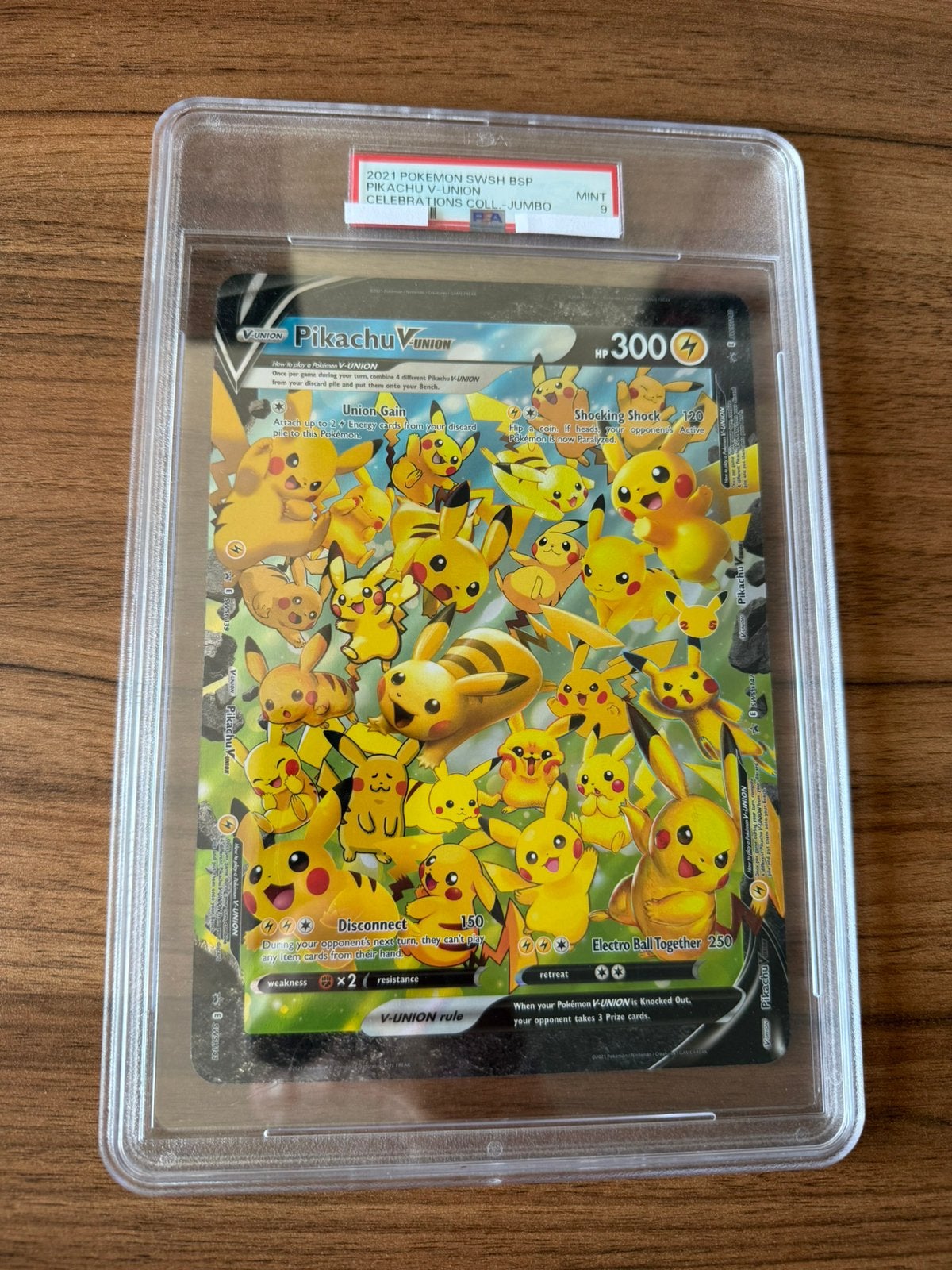 2021 Pokemon SWSH Jumbo Pikachu V-union PSA 9, Ophalen of Verzenden, Zo goed als nieuw