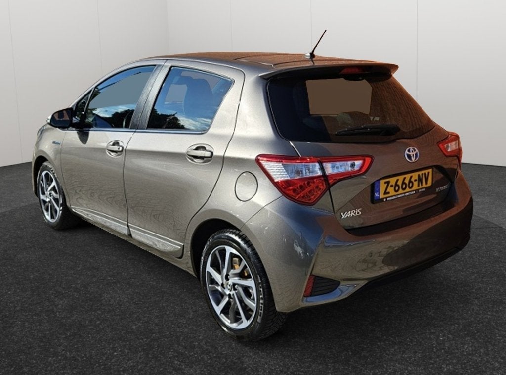 Toyota Yaris 1.5 Hybride Premium Panoramadak Half Leder Came, Auto's, 12 maanden, Euro 6, 4 cilinders, Leder en Stof