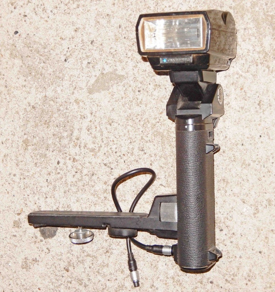 Olympus Quick Auto 310 flitser met bounce grip+kabel, Ophalen of Verzenden, Gebruikt, Staafflitser, Olympus