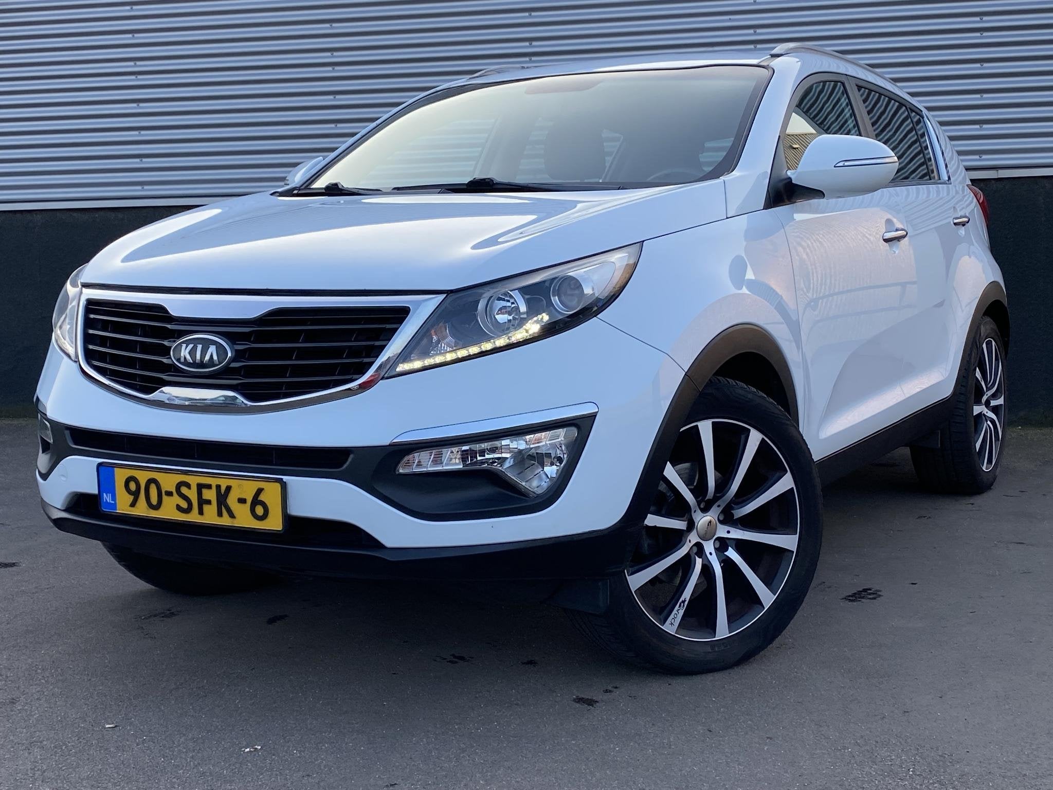 Kia Sportage 2.0 X-ecutive Plus Pack Climate control, Cruise, Auto's, Gebruikt, 4 cilinders, Leder en Stof, Handgeschakeld