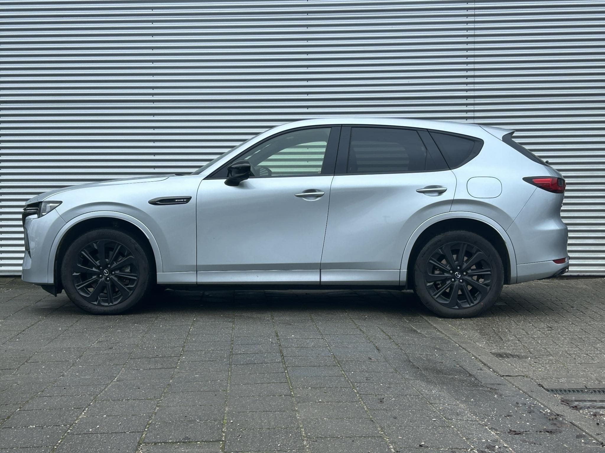Mazda CX-60 2.5 e-SkyActiv PHEV Homura Business Edition | Tr, Auto's, Lichtsensor, Gebruikt, 4 cilinders, 2500 kg