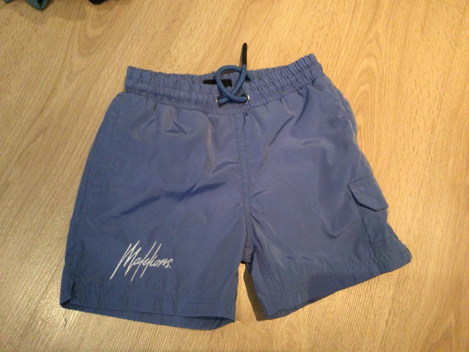 Malelions zwemshort maat 128 zo goed als nieuw, Zo goed als nieuw, Zwembroek, Jongen, Ophalen of Verzenden