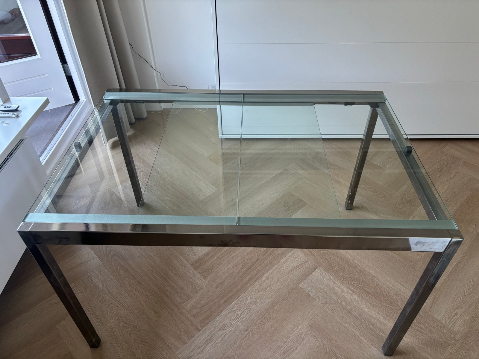 Uitschuifbare glazen eettafel met metalen frame, Ophalen, Gebruikt, 100 tot 150 cm, 50 tot 100 cm