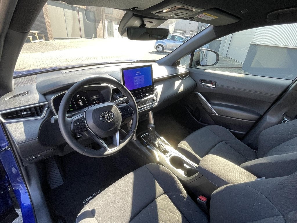 Toyota Corolla Cross 2.0 High Power Hybrid Active | Trekhaak, Auto's, Toyota, Stof, Gebruikt, 4 cilinders, Automatische klimaatregeling