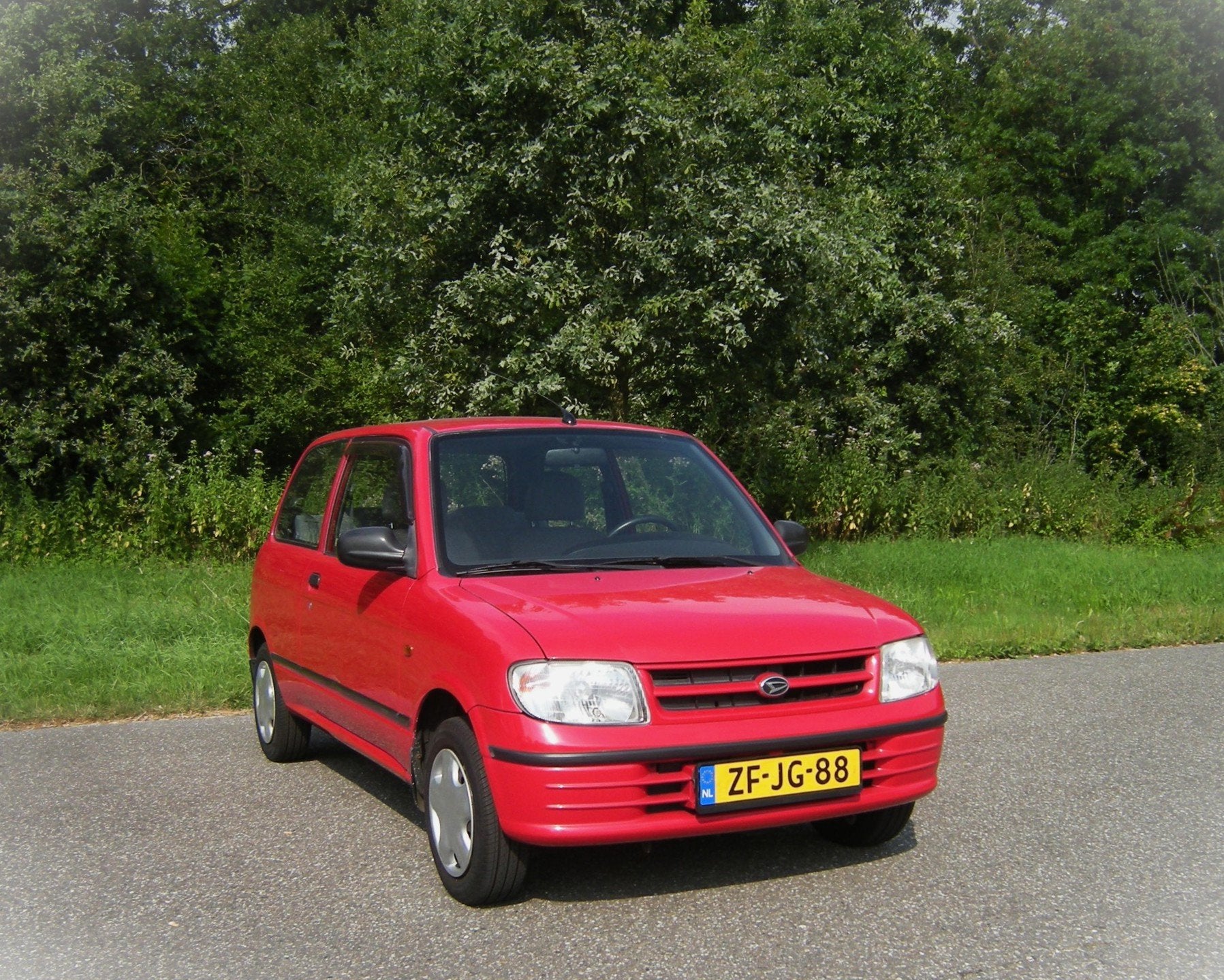 Daihatsu Cuore 1.0-12V RTi . 3 Drs AUTOMAAT . PDC achterzijd, Auto's, Daihatsu, Gebruikt, Zwart, 18 €/maand, 4 stoelen
