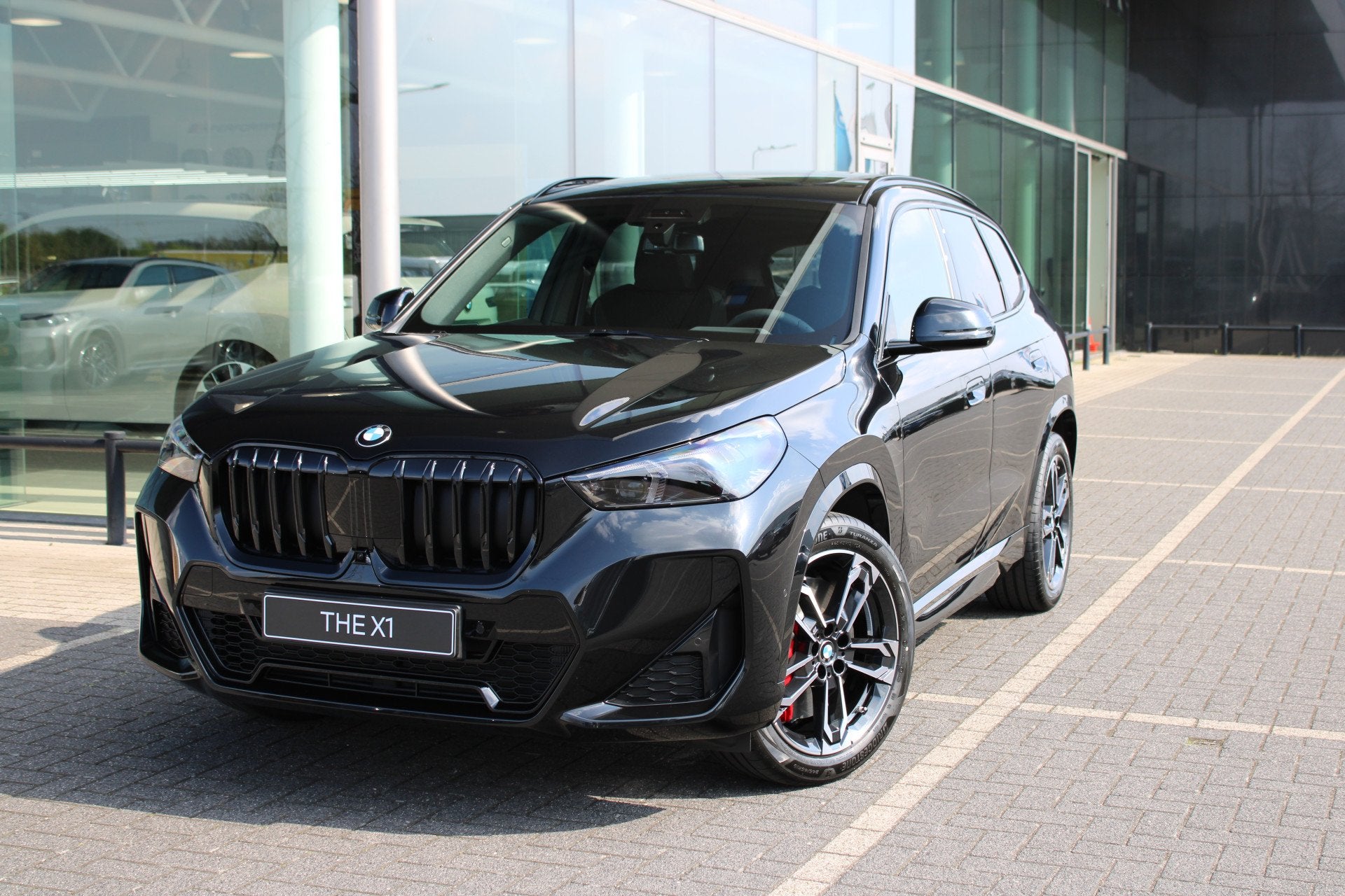 BMW X1 sDrive20i M Sport Automaat / Trekhaak / Panoramadak /, Auto's, 1525 kg, Stoelverwarming, Zwart, 156 pk