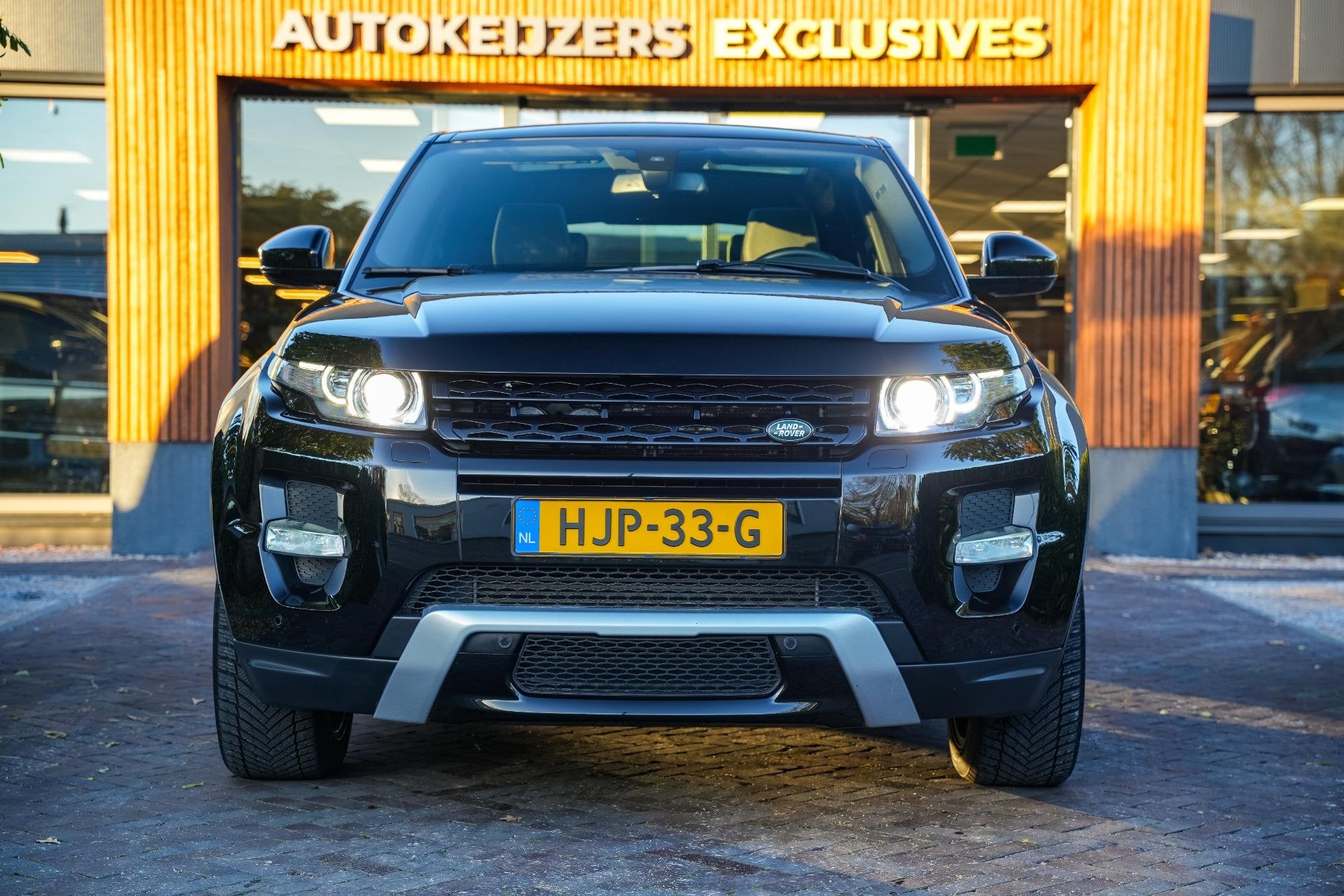 Land Rover Range Rover Evoque 2.0 Si 4WD Prestige Dynamic St, Auto's, Euro 5, 4 cilinders, Zwart, Leder