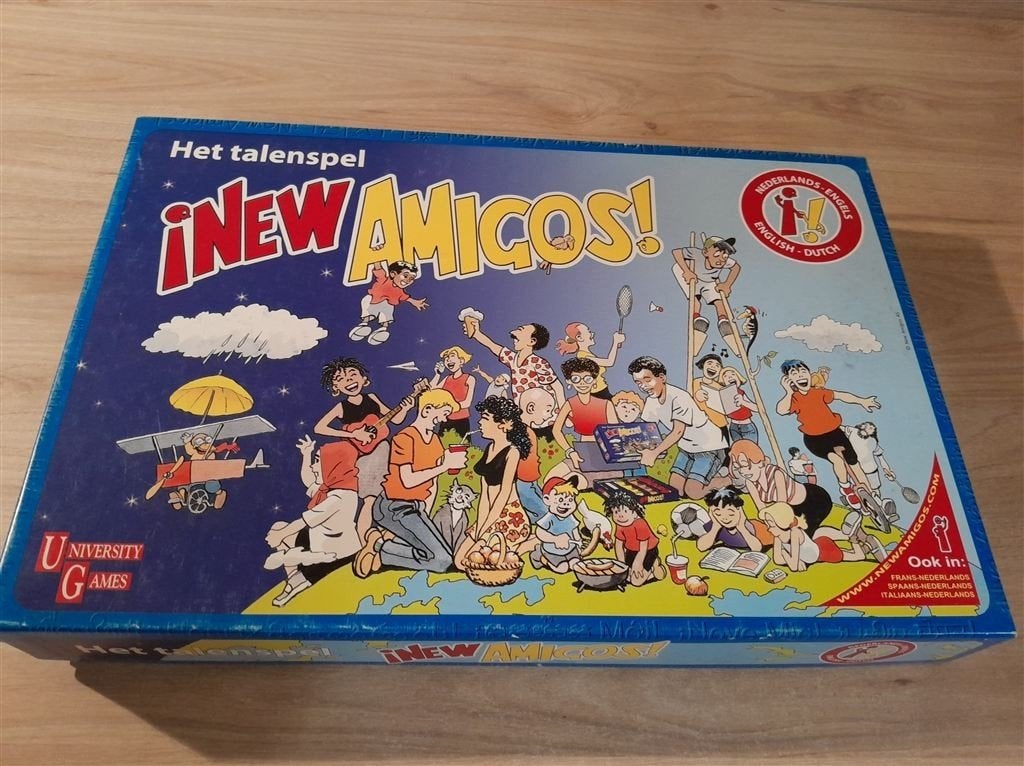 New Amigos - Het talenspel - Engels - Nederlands - s5863, Hobby en Vrije tijd, Gezelschapsspellen | Bordspellen, Verzenden, Zo goed als nieuw