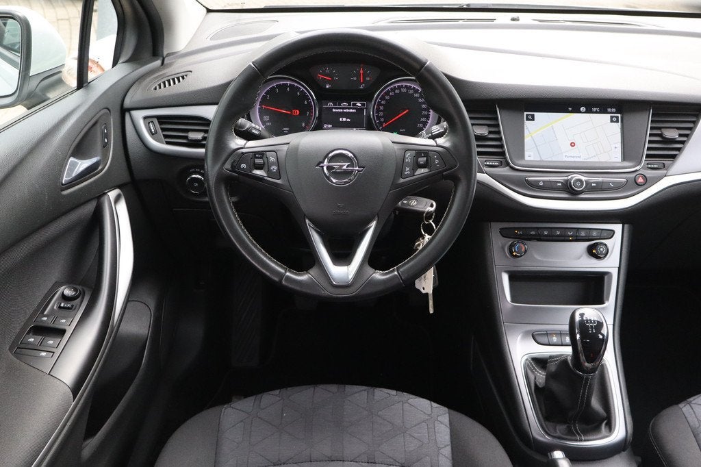 Opel Astra Sports Tourer 1.0 Turbo 120 Jaar Edition NL-Auto!, Stof, Gebruikt, Euro 6, 1178 kg