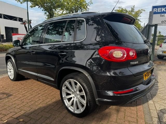 Volkswagen Tiguan 2.0 TSI 200pk Sport&Style 4Motion R-Line A, Auto's, Automaat, Euro 5, 1566 kg, Gebruikt