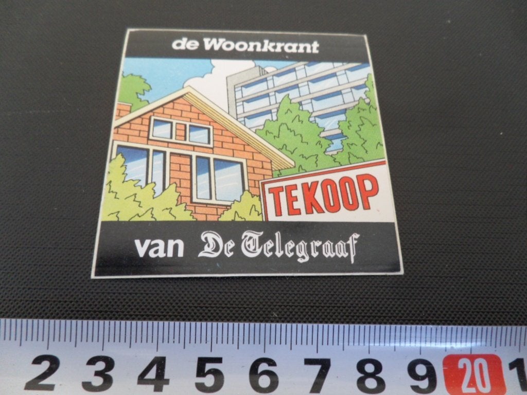 sticker krant strip de woonkrant van de telegraaf, Verzamelen, Ophalen, Zo goed als nieuw