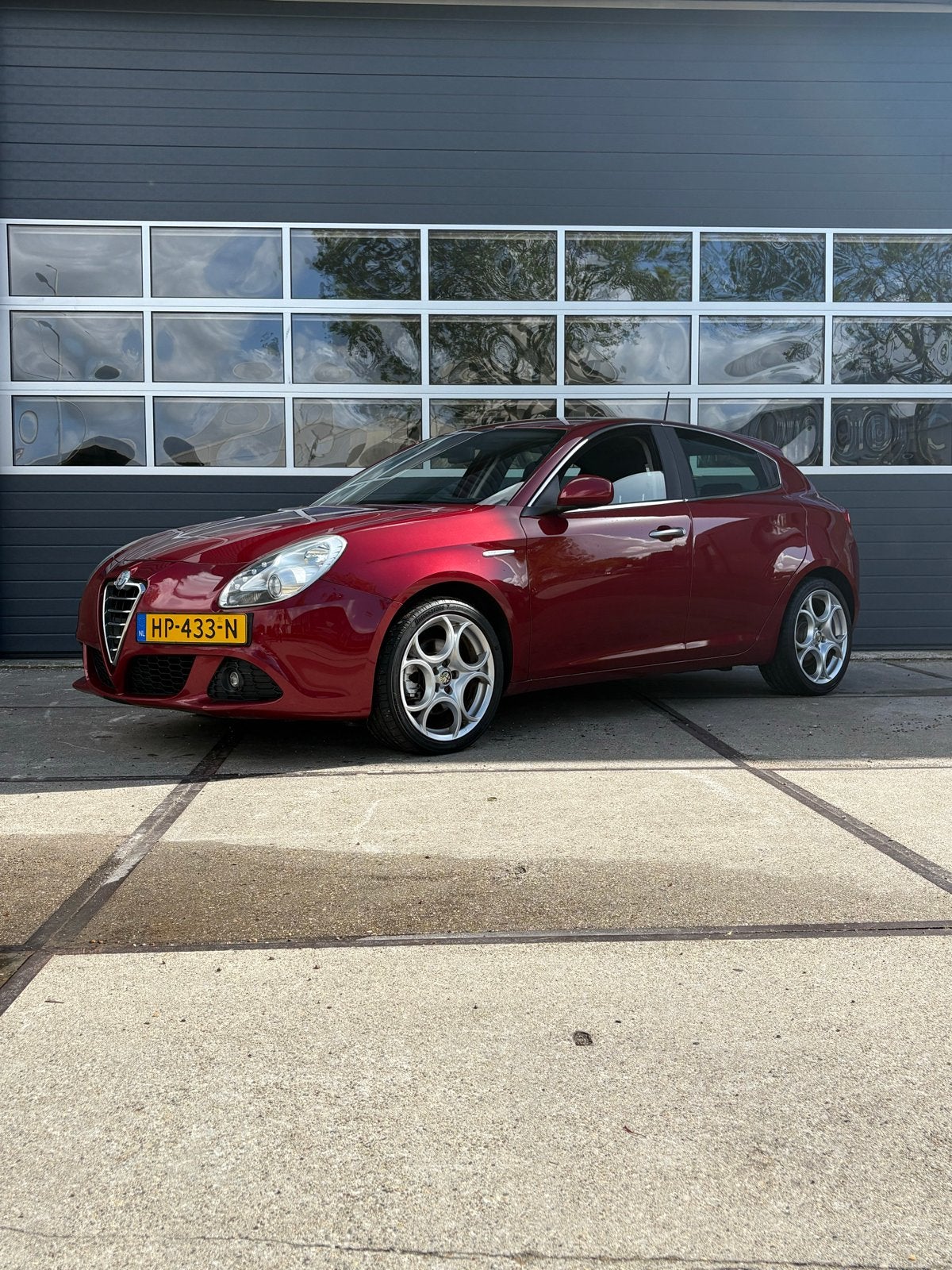 Alfa Romeo Giulietta 1.4 Turbo Multi AIR 2011 Rood, Auto's, Voorwielaandrijving, Euro 5, Stof, Zwart