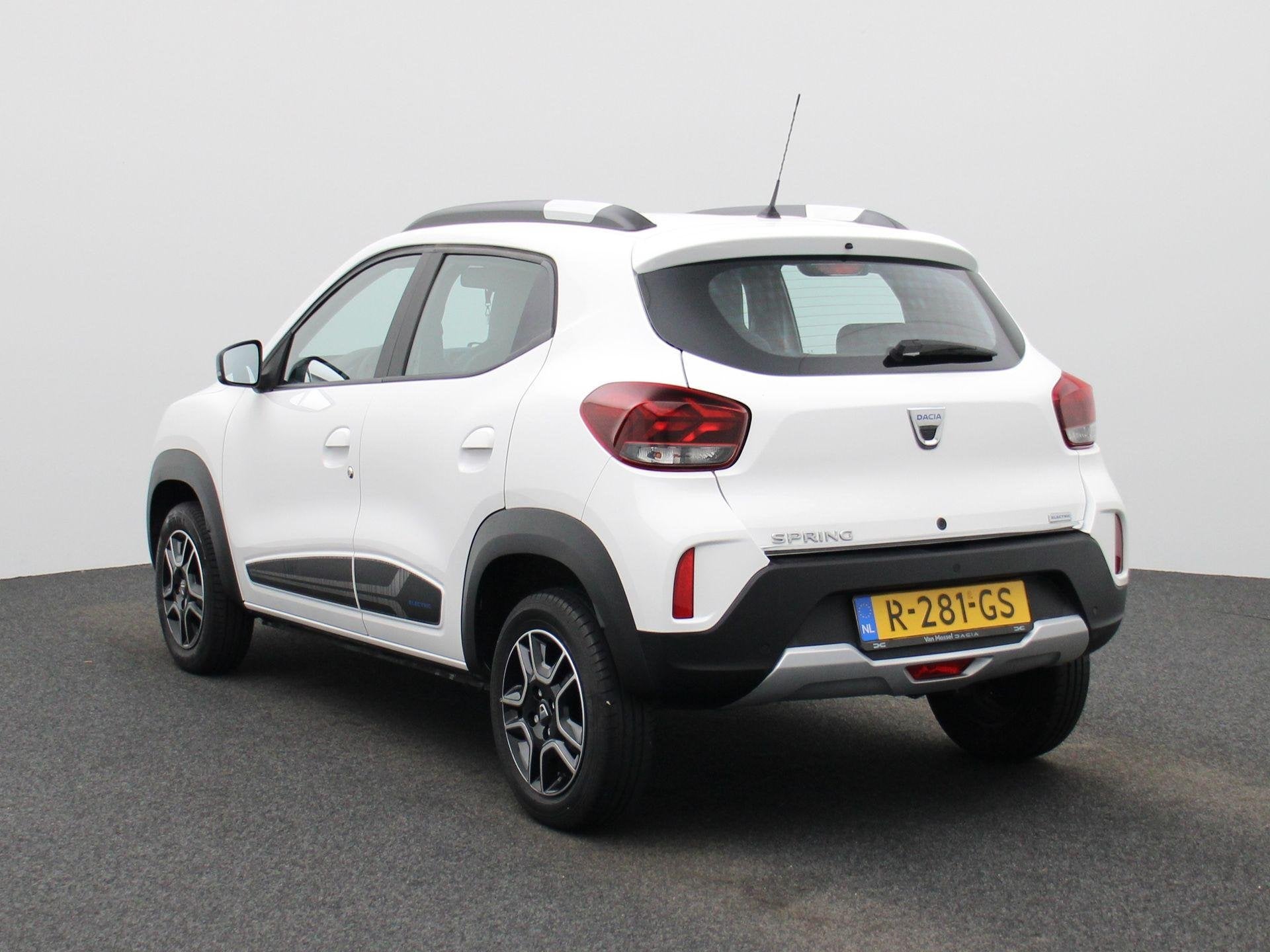 Dacia Spring Comfort 27 kWh | BTW AUTO | AIRCO | PARKEERSENS, Auto's, Gebruikt, Leder en Stof, Wit, Te koop