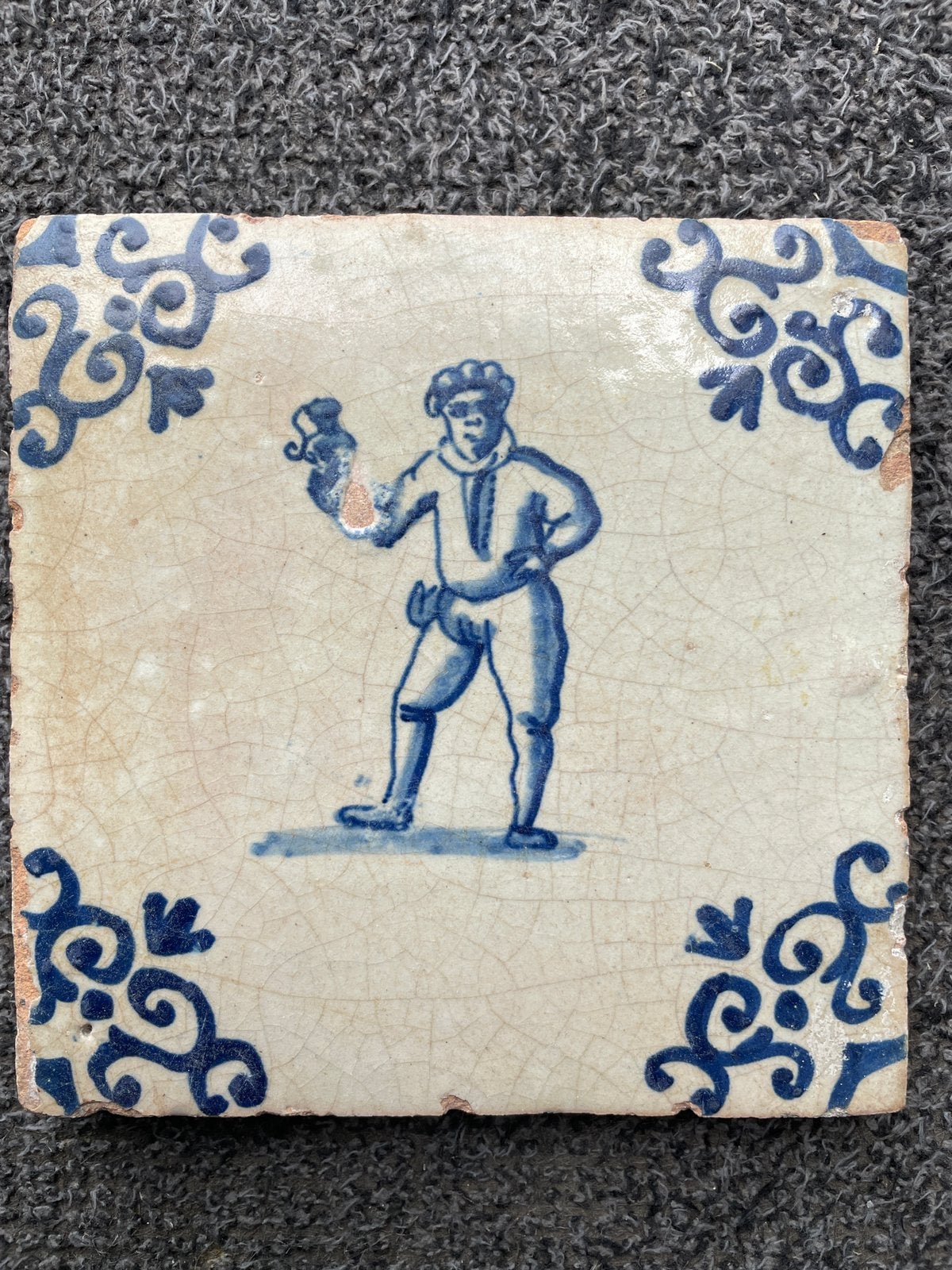 17e eeuwse tegel met drinkebroeder. Voluuthoek., Antiek en Kunst, Ophalen of Verzenden