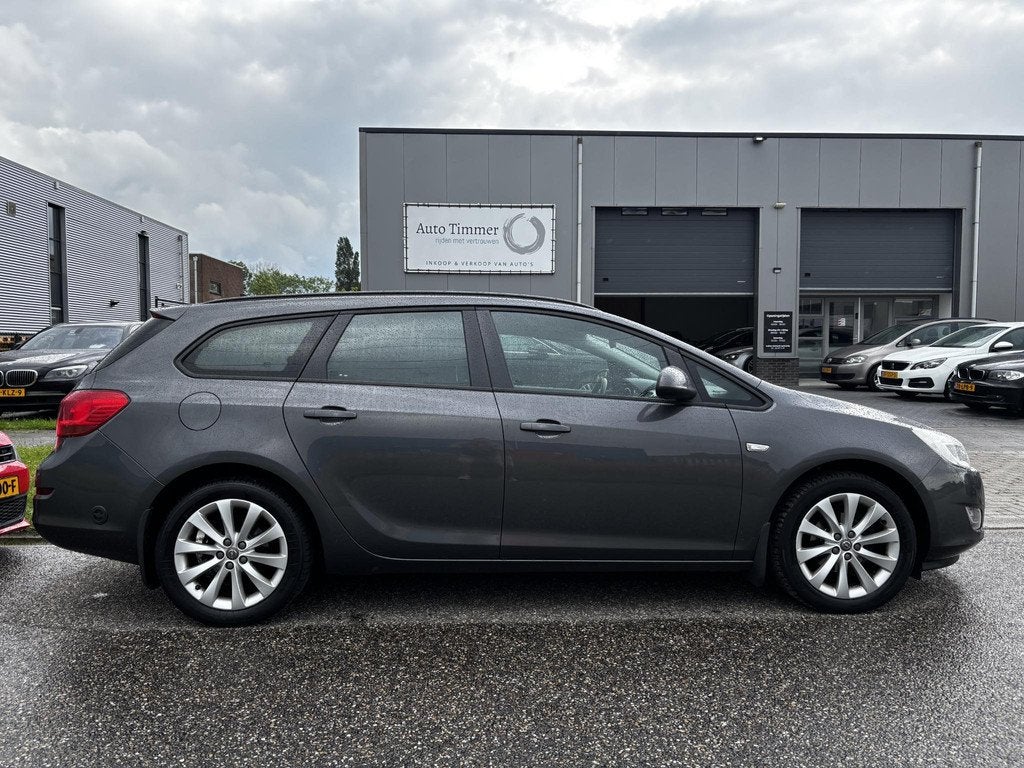 Opel Astra Sports Tourer 1.4 Anniversary Edition LPG-G3 NAVI, Auto's, Voorwielaandrijving, Euro 5, Gebruikt, 4 cilinders