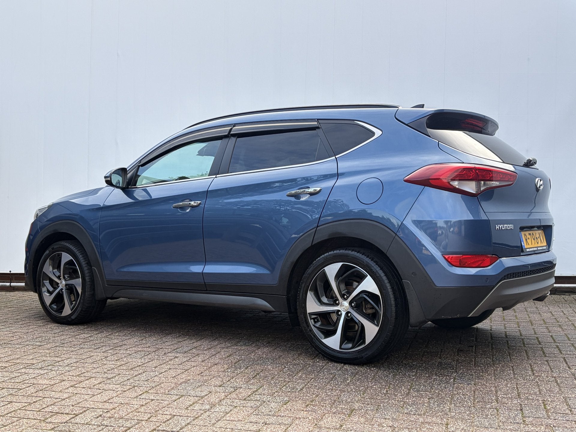 Hyundai Tucson 1.6 T-GDi Premium 4WD Pano Trekhaak StoelVerw, Auto's, Lichtsensor, Gebruikt, 4 cilinders, Blauw