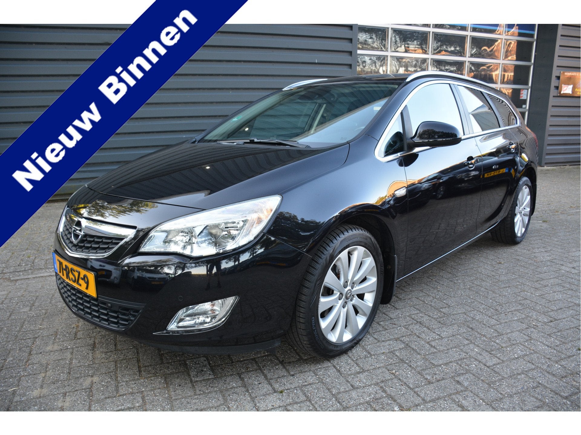 Opel Astra Sports Tourer 1.4 Turbo Cosmo Automaat Trekhaak, Auto's, Opel, Gebruikt, Zwart, 4 cilinders, Zwart