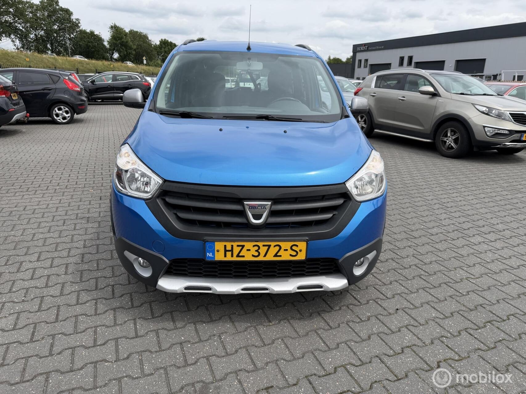 Dacia Lodgy 1.2 TCe Stepway 7p. camera navi 7 persoons, Auto's, Dacia, Voorwielaandrijving, Stof, Gebruikt, Blauw