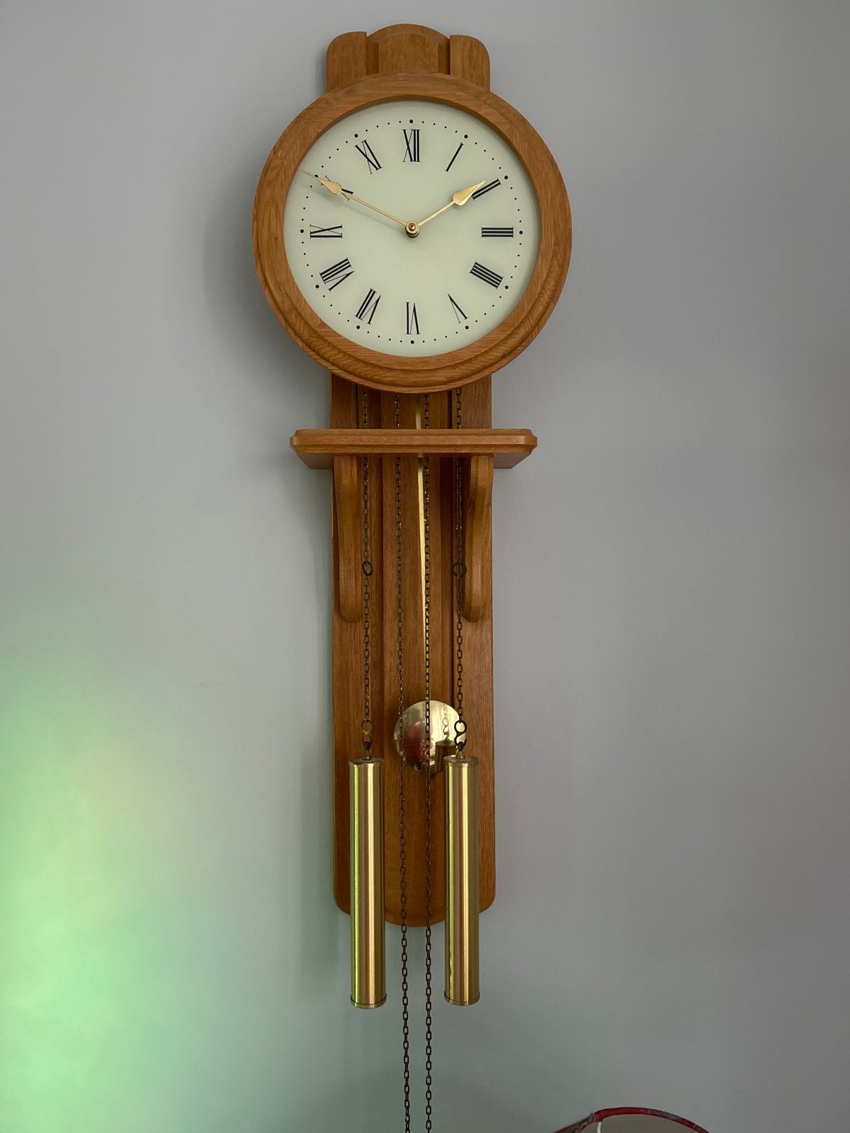 Wandklok met gewichten en slagwerk, Ophalen