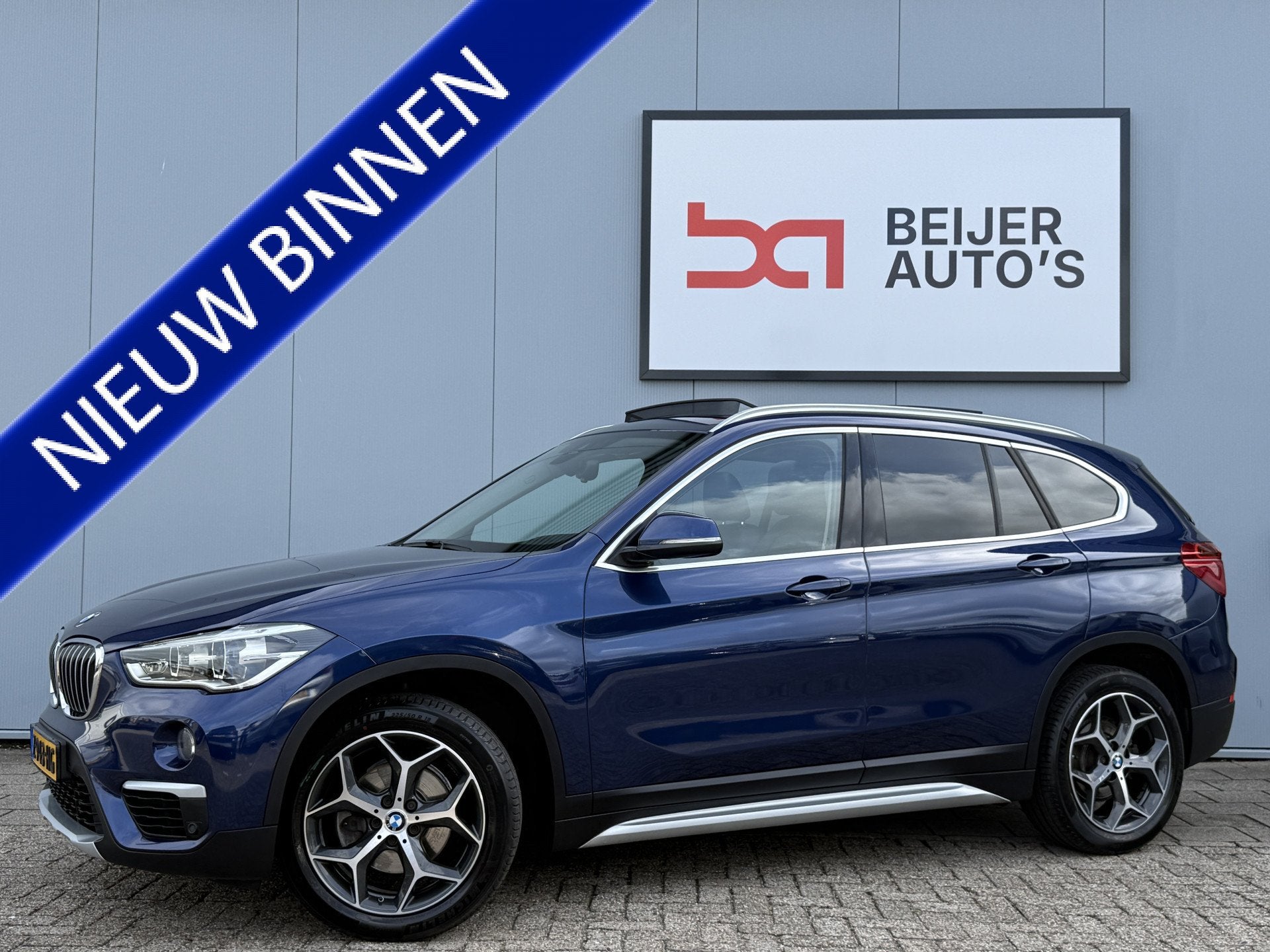 BMW X1 sDrive18i High Executive Automaat Schuifdak/Trekhaak., 136 pk, Gebruikt, Euro 6, Blauw