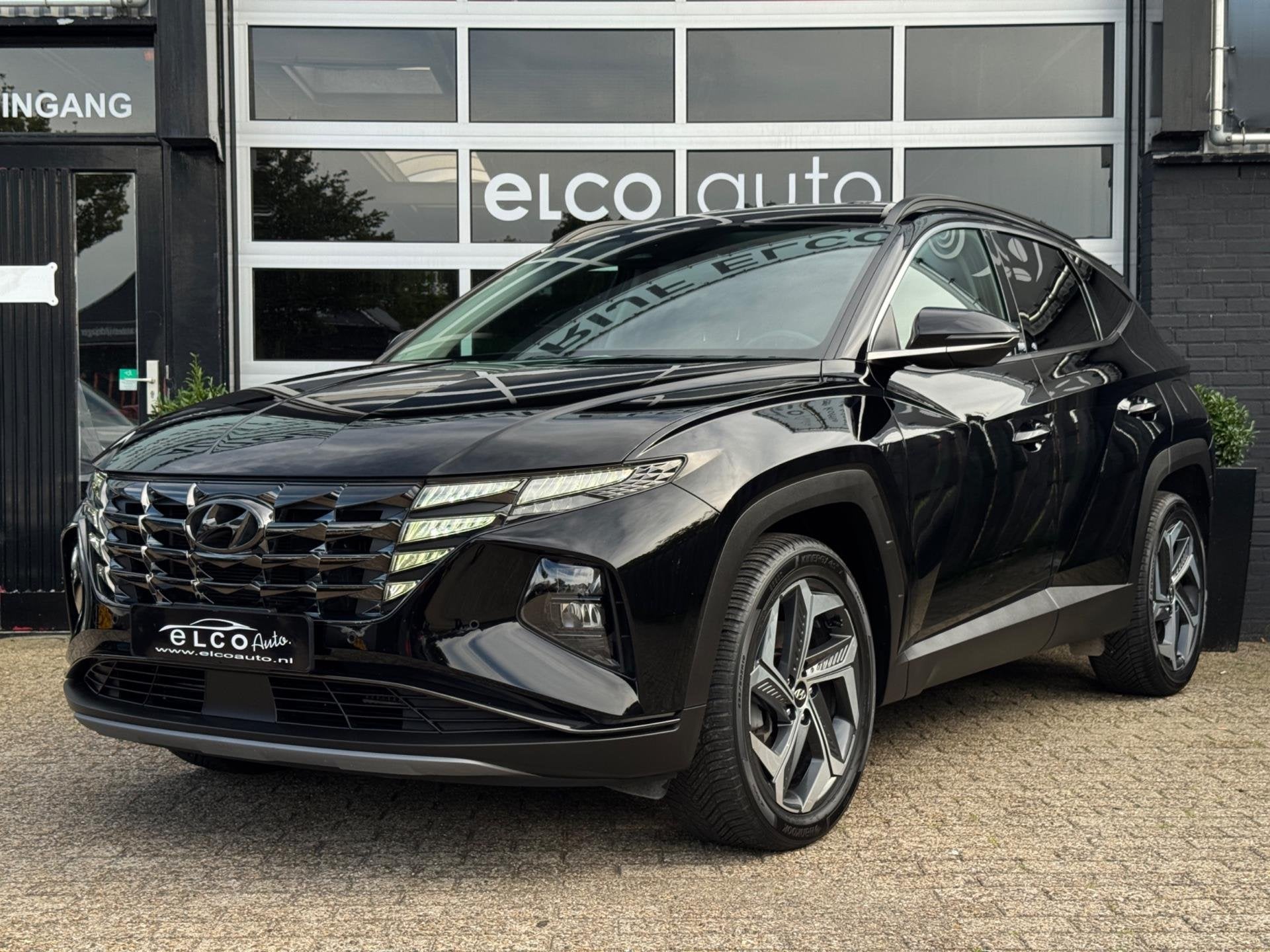 Hyundai TUCSON 230pk Smart Hybrid Exellence Premium HEV, Auto's, Gebruikt, 4 cilinders, 1650 kg, Zwart
