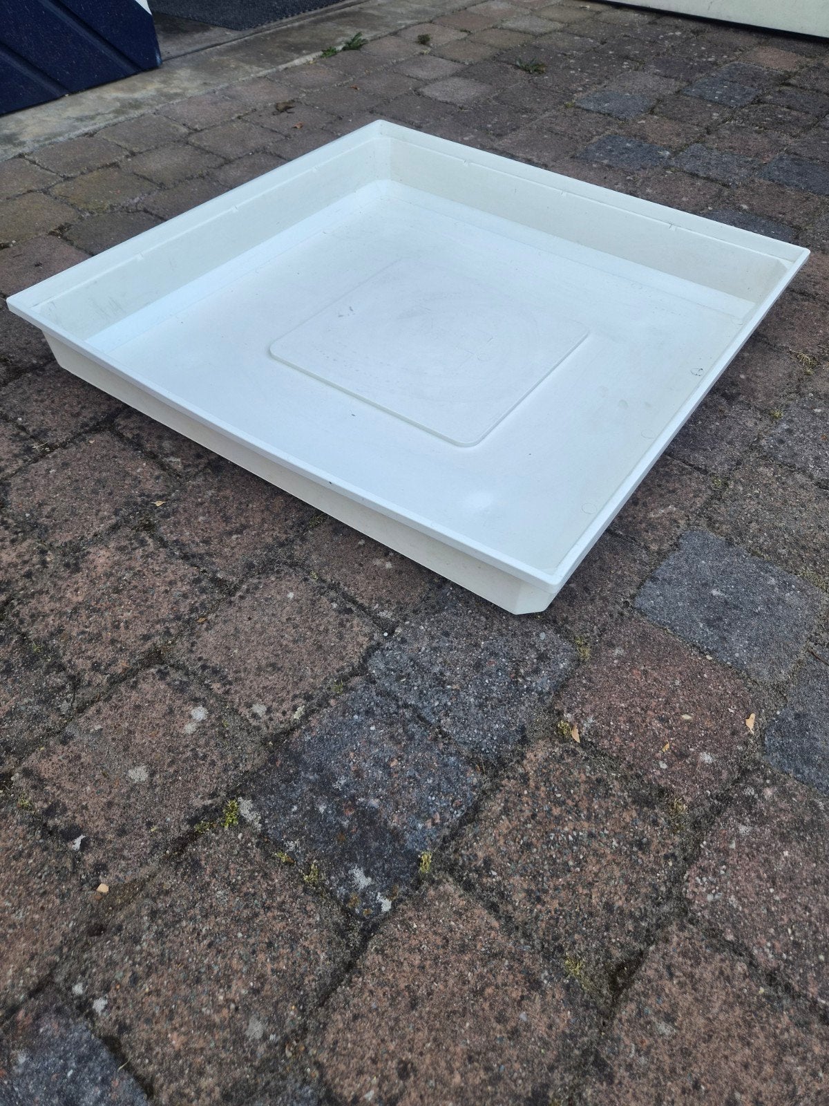 Wasmachine lekbak, Ophalen