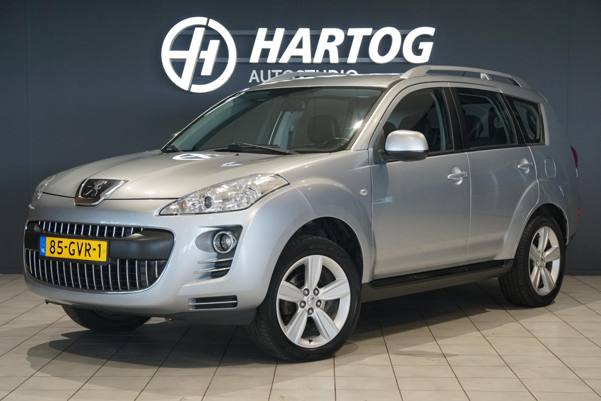 Peugeot 4007 2.4 ST 7p. + 4WD / TREKHAAK / NAVIGATIE / CRUIS, Auto's, Peugeot, Stof, Gebruikt, 4 cilinders, Bedrijf