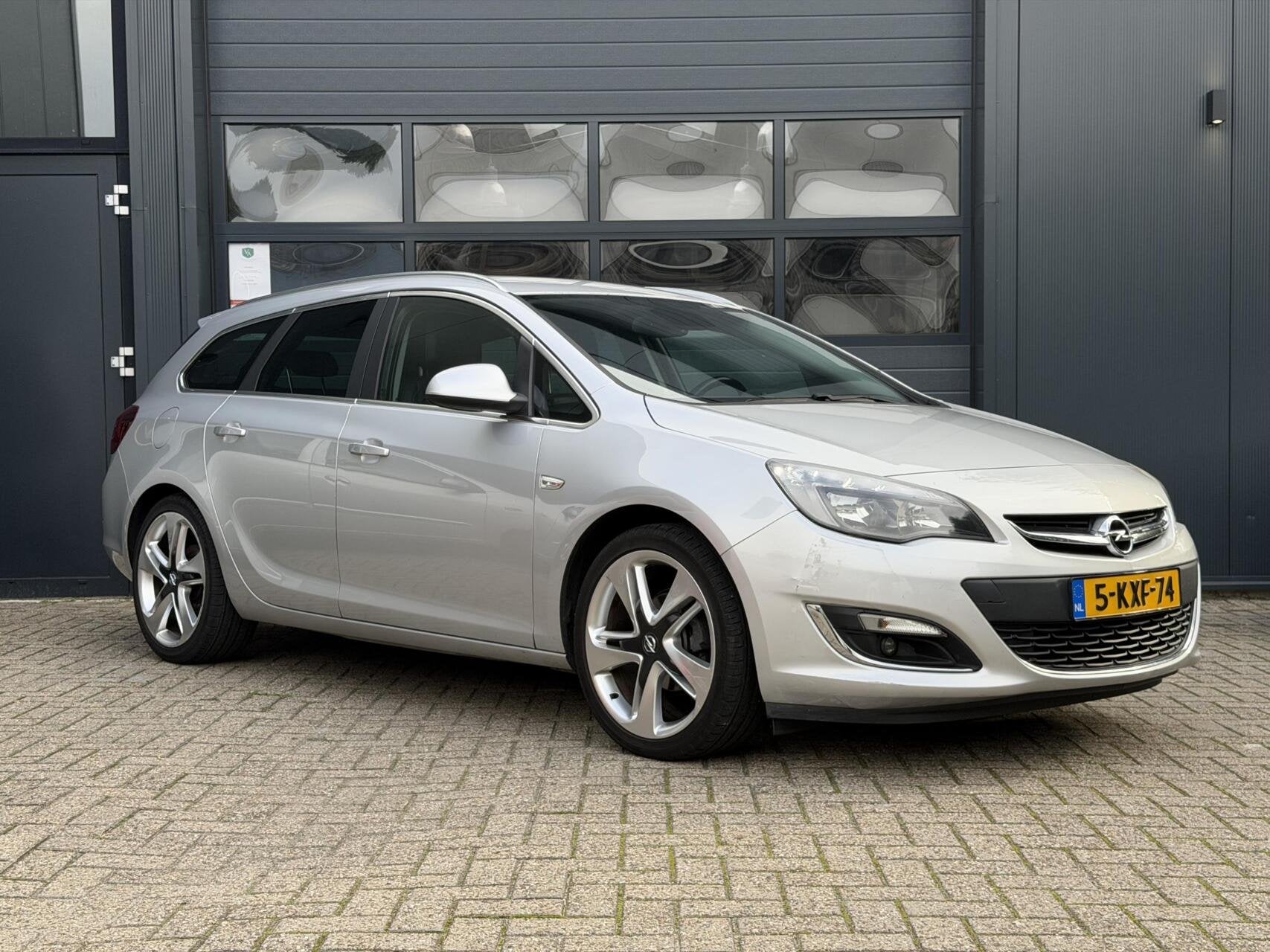 Opel Astra Sports Tourer 1.4 Turbo | Airco | Cruise, Voorwielaandrijving, Euro 5, Gebruikt, 4 cilinders