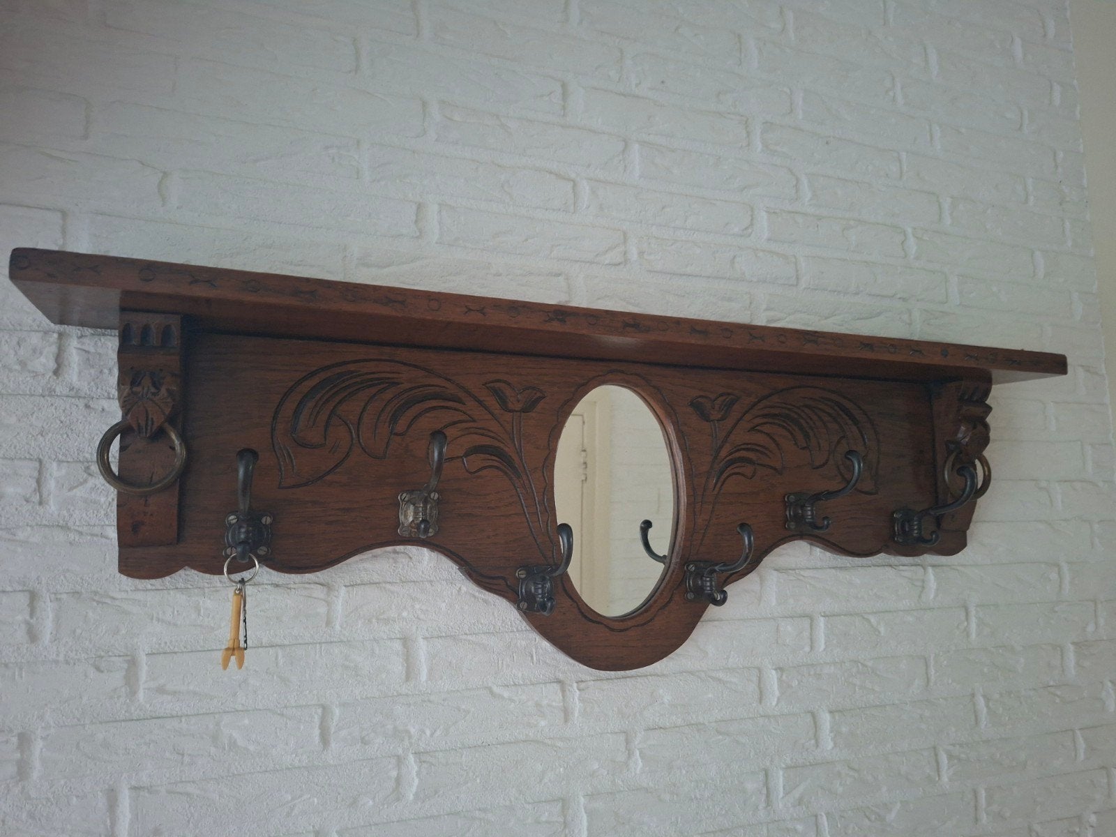 Antieke houten kapstok met spiegel en snijwerk, Ophalen