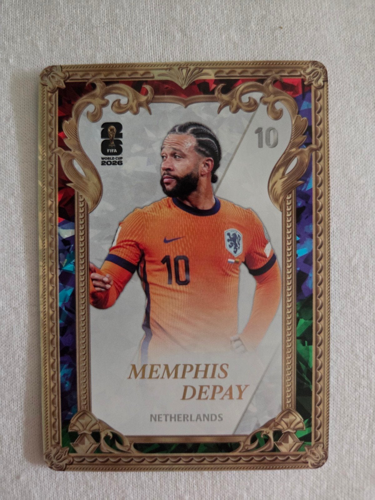 Memphis Depay Panini  Kayou FIFA World Cup 2026 – Gold Fram, Ophalen of Verzenden, Zo goed als nieuw, Buitenlandse clubs, Spelerskaart
