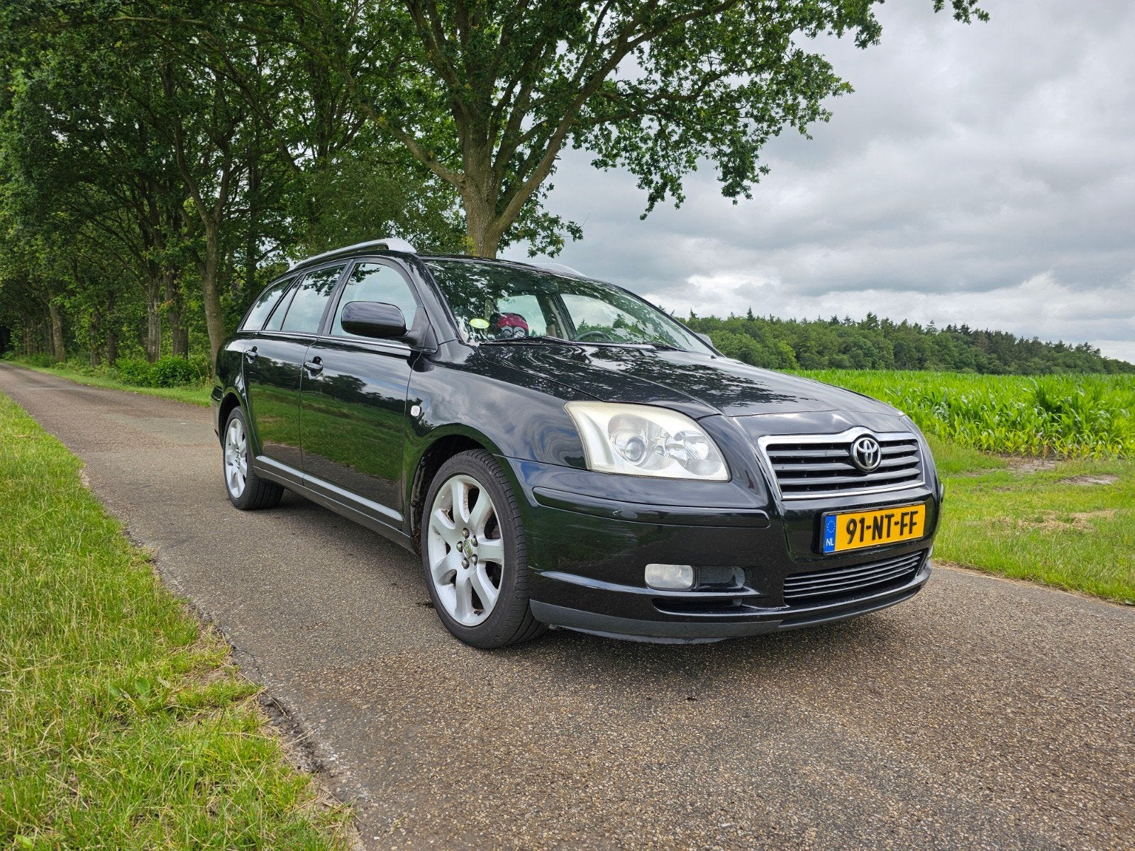 Toyota Avensis 2.0 2004 met nieuwe apk, Auto's, Voorwielaandrijving, Stof, Avensis, Zwart