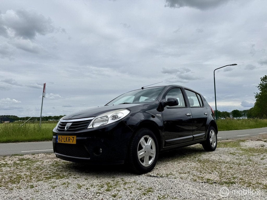 Dacia Sandero 1.4 Lauréate LPG, BJ 2010, Airco, APK Jun 202, Auto's, Voorwielaandrijving, Gebruikt, 4 cilinders, Zwart